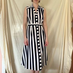 Sleeveless navy and white striped dress.